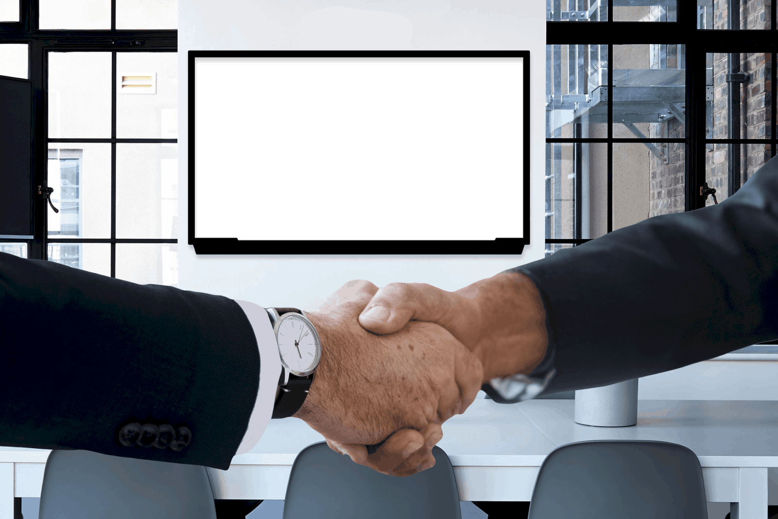 Men Shaking Hands In A Virtual Office