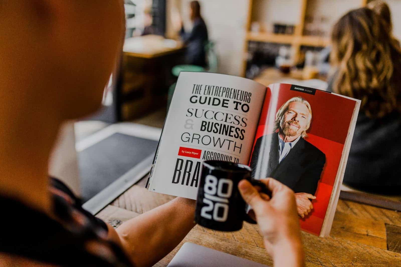  Reading a Book About Business in a Virtual Office